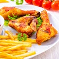 Grilled chicken wings,legs,chips and vegetables Royalty Free Stock Photo