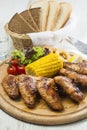 Grilled chicken wings with sweet corn. Royalty Free Stock Photo