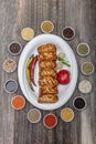 Traditional Turkish Cuisine, Grilled chicken wings baking on wooden background, top view Royalty Free Stock Photo