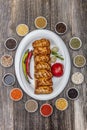 Traditional Turkish Cuisine, Grilled chicken wings baking on wooden background, top view Royalty Free Stock Photo