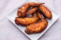 Grilled chicken wings on white plate. Royalty Free Stock Photo
