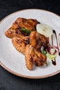 Grilled chicken wings on white plate Royalty Free Stock Photo