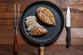 Grilled chiken fillet on frying pan