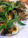 Grilled clamshell - a famous seafood in Vietnam.