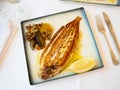 Grilled common sole with lemon and baked vegetables Royalty Free Stock Photo