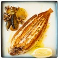 Grilled common sole with lemon and baked vegetables Royalty Free Stock Photo
