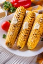 Grilled corn cob on white wooden rustic background Royalty Free Stock Photo