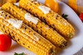 Grilled corn cob on white wooden rustic background Royalty Free Stock Photo