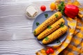 Grilled corn cob on white wooden rustic background Royalty Free Stock Photo