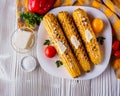 Grilled corn cob on white wooden rustic background Royalty Free Stock Photo