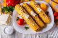 Grilled corn cob on white wooden rustic background Royalty Free Stock Photo