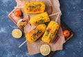 Grilled corn cobs with garlic and pepper Royalty Free Stock Photo