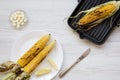 Grilled corn cobs,knife and butter Royalty Free Stock Photo