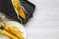 Grilled corn cobs with lemon, top view. Royalty Free Stock Photo