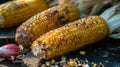 Grilled Corn Cobs on a Rustic Wooden Surface Royalty Free Stock Photo