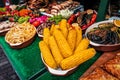 Grilled corn cobs, sausages and vegetables Royalty Free Stock Photo
