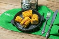 Grilled corn cobs on wooden background, top view Royalty Free Stock Photo