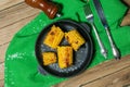 Grilled corn cobs on wooden background, top view Royalty Free Stock Photo