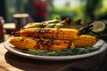 Grilled corn on a plate at a picnic