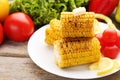 Grilled corns with butter and vegetables Royalty Free Stock Photo