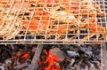 Grilled crab on flaming grill.
