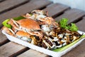 Grilled crabs and squid in foam tray