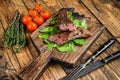 Grilled Cut Skirt machete meat beef Steak on a cutting board. wooden background. Top view