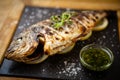 Grilled dorada fish with lemon and spinach Royalty Free Stock Photo