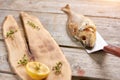 Grilled dorado fish with spicery on wooden table. Royalty Free Stock Photo