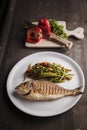 Grilled dorada fish with steamed green beans Royalty Free Stock Photo