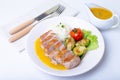 Grilled duck with mashed cauliflower, fried brussels sprouts and orange sauce on a white plate. Royalty Free Stock Photo