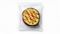 Grilled Eggplant in Clear Packaging on White Background Royalty Free Stock Photo