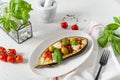 Grilled eggplant with mozzarella, cherry tomatoes, basil and olives on a plate on white background. Aubergine seasonal vegan Royalty Free Stock Photo