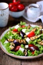 Grilled eggplant salad, tomatoes, feta and lettuce with olive oil and red balsamic, sea salt and pink pepper. Royalty Free Stock Photo