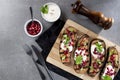 Grilled eggplants with garlic yogurt sauce, walnuts and pomegranate, top view