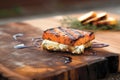 grilled feta cheese on cedar plank with grill marks Royalty Free Stock Photo