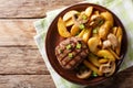 Grilled fillet mignon with potatoes and mushrooms close-up. Horizontal top view Royalty Free Stock Photo