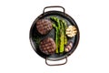 Grilled Fillet Mignon Steak with roasted asparagus. Isolated, white background. Royalty Free Stock Photo