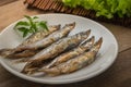 Grilled fish capelin or shishamo on plate Royalty Free Stock Photo