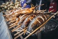 Grilled fish is on the counter of a street shop. Street food in Asia Royalty Free Stock Photo