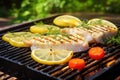 grilled fish fillet with lemon slices on a bbq Royalty Free Stock Photo