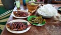 Grilled fish with fresh petai and rice on a sunny afternoon