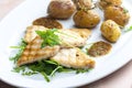 grilled fish with grilled potatoes Royalty Free Stock Photo