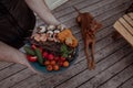 Grilled fish and shrimp with vegetables on plate in hand Royalty Free Stock Photo