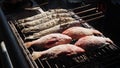 Grilled fish with spices on fire close up. Grilling fish dorado on campfire.