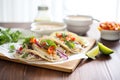 grilled fish tacos with creamy chipotle sauce on paper Royalty Free Stock Photo