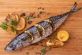 Grilled fish and various vegetables on a chopping board Royalty Free Stock Photo