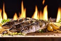 Grilled fishs and various vegetables on wooden table Royalty Free Stock Photo