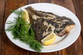 Grilled flounder on the white plate