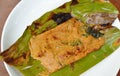 Grilled flower crab with curry paste in banana leaf on plate